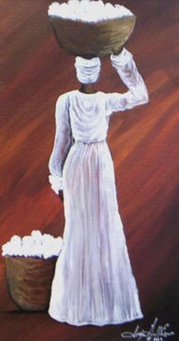 Woman carrying large bowl on her head